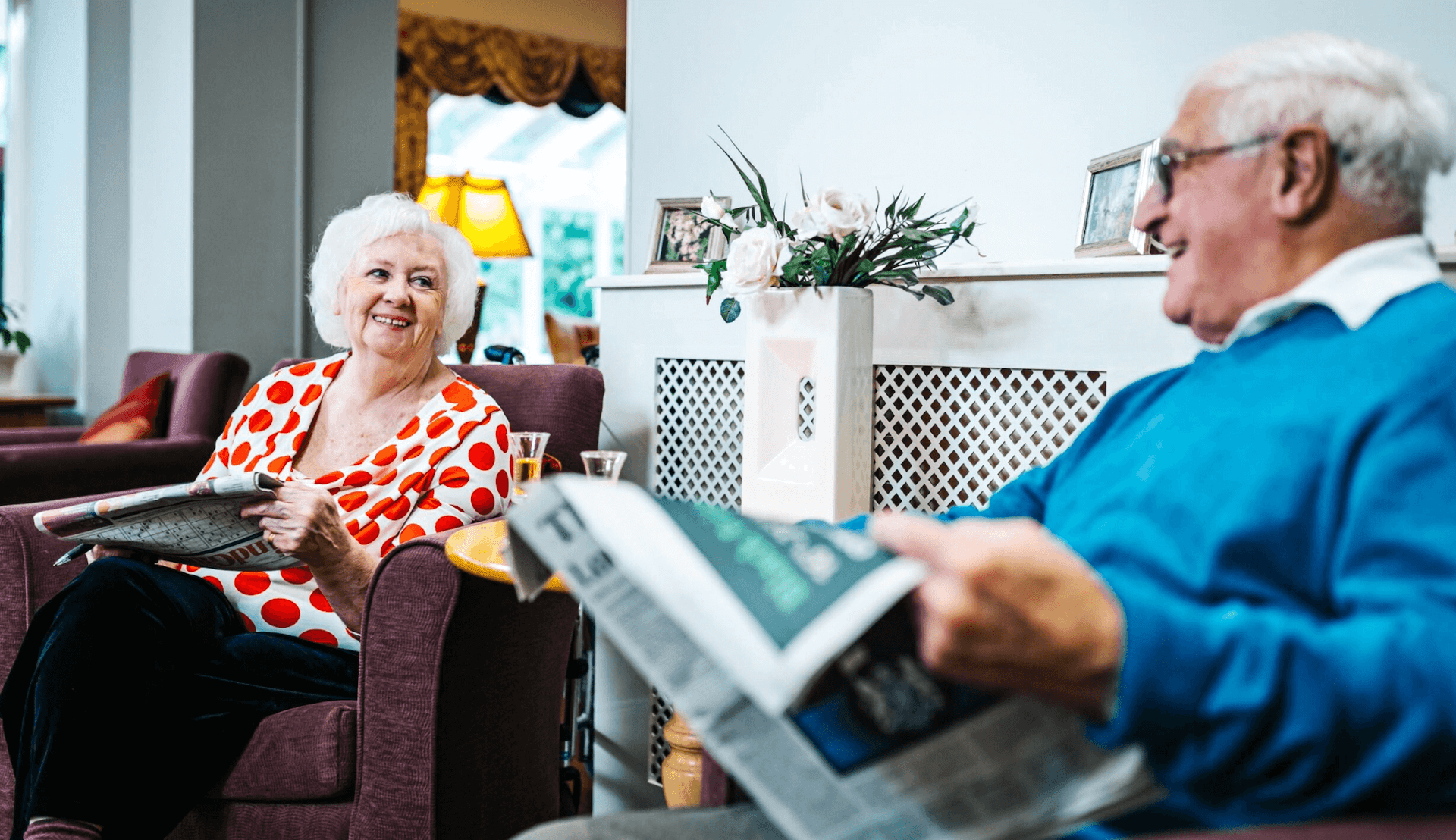care home residents reading the newspaper