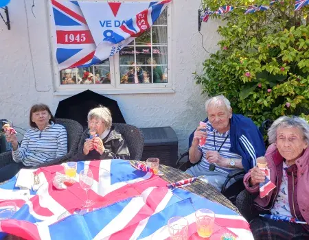 Our wonderful residents enjoying a local ukulele band over ice-cream