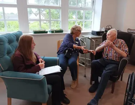Residents discuss the stories with a Student from Moulton School & College