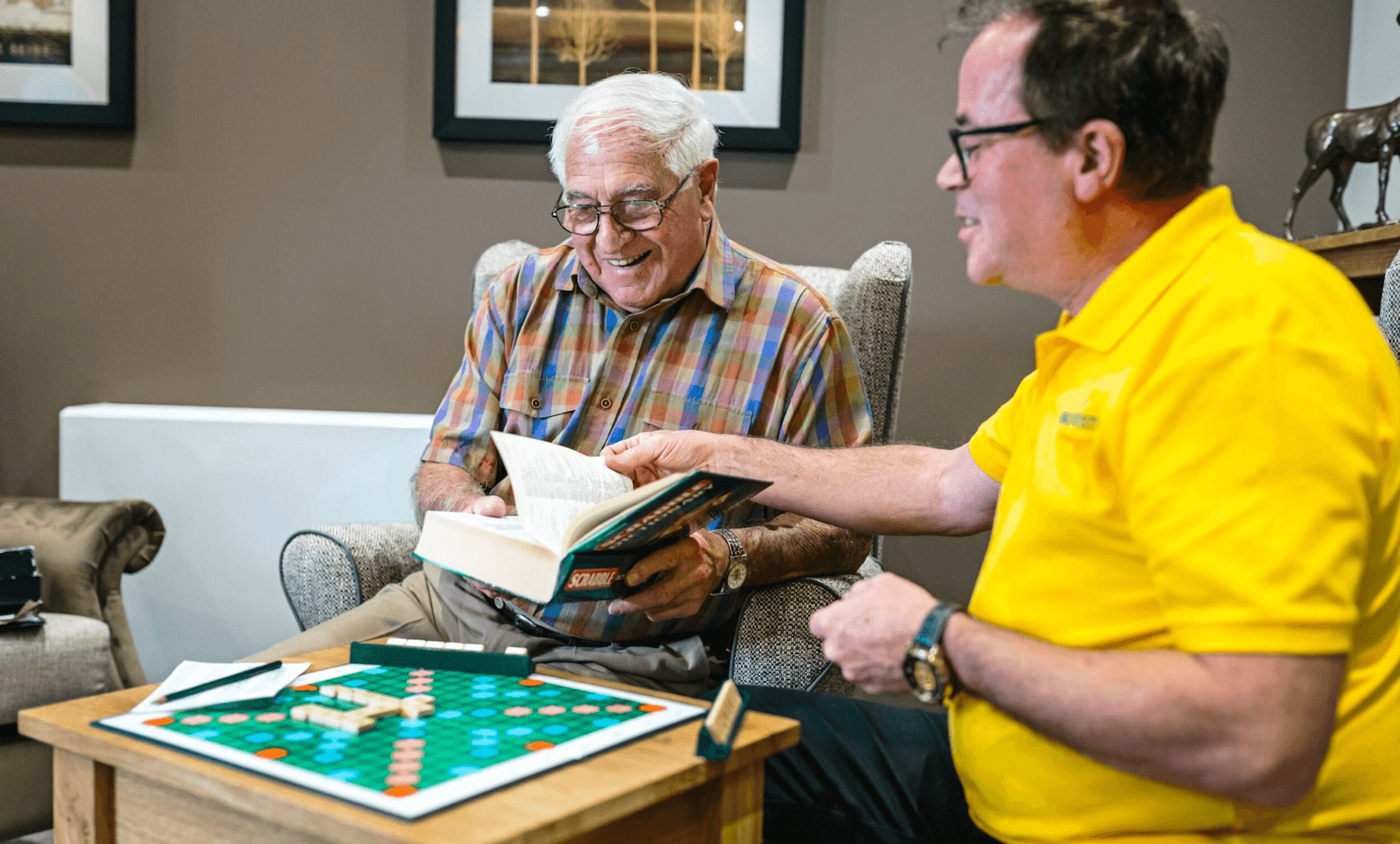 Older person playing Scrabble in a Barchester care home